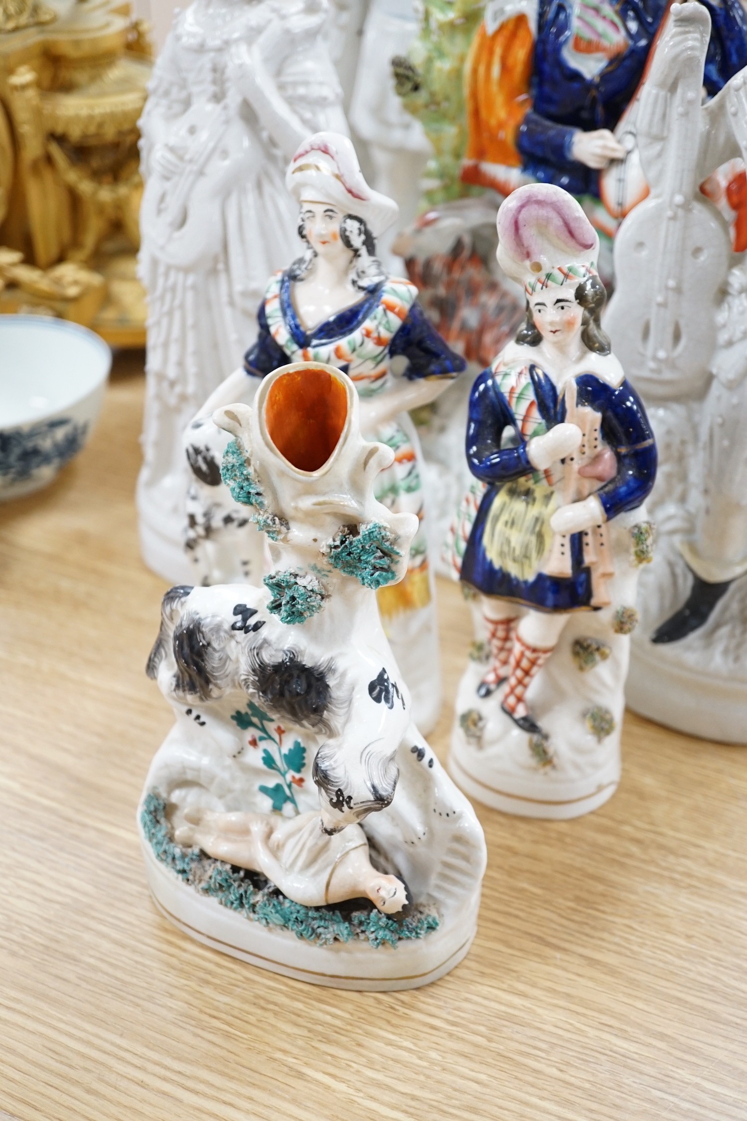 A pair of Staffordshire flat back of musicians another and five other flat backs , tallest 46cms high